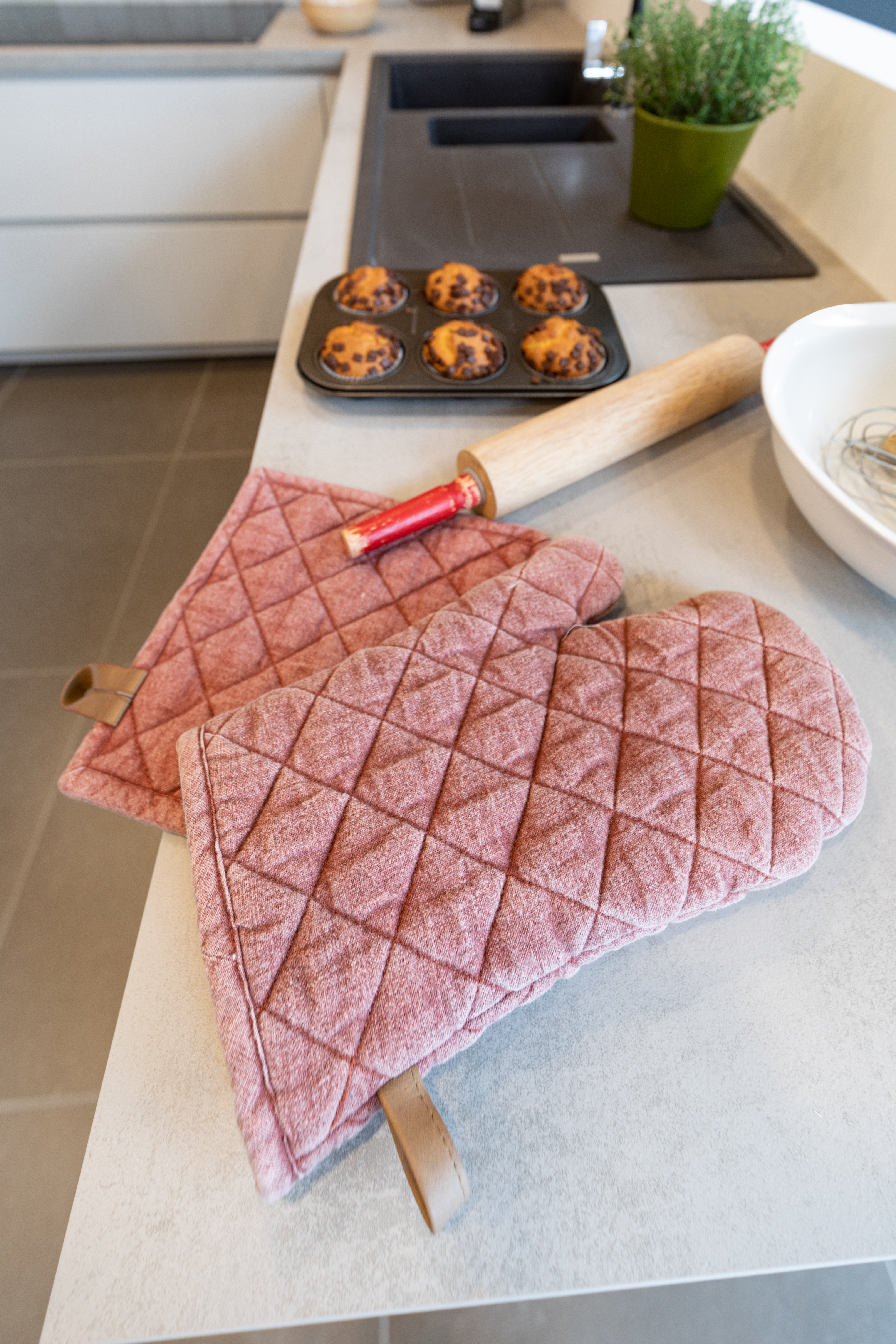 Close up photo of a pot holder and oven mitt
